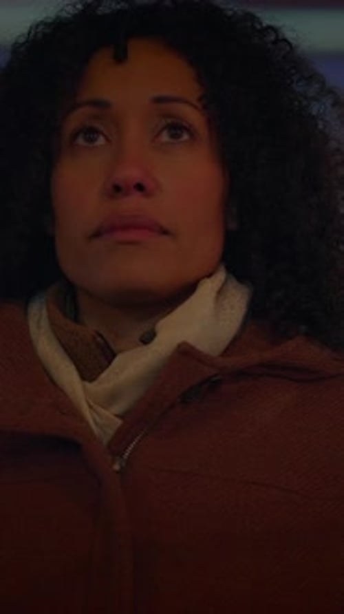 Serious Woman Looking Upwards at Night Indoors