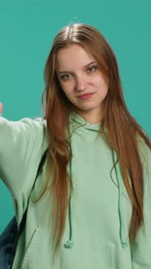 Vertical Video Frustrated Woman Showing Thumbs Down Sign Gesturing