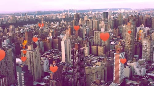 Aerial view of city buildings with heart graphics
