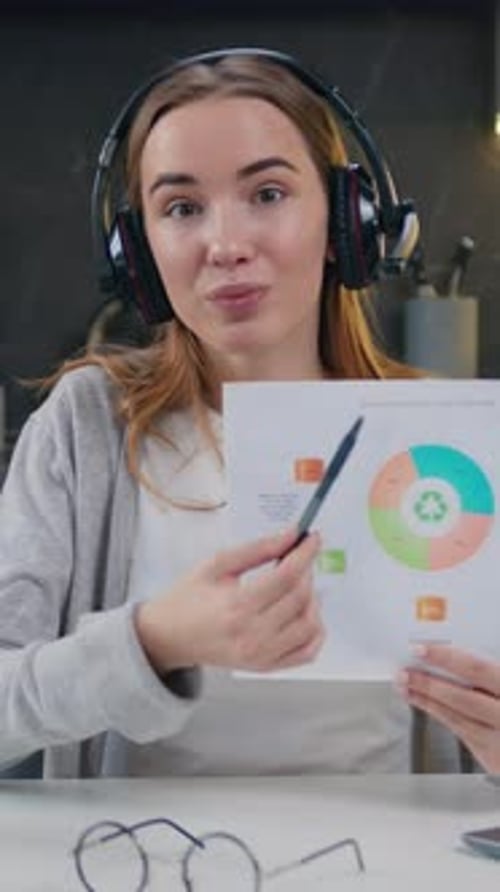 Smiling Woman Explains Graph During Virtual Meeting