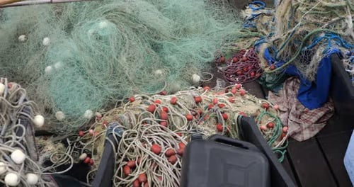 Fishing rods and fishing nets on the pier in the port of Piran, Slovenia.