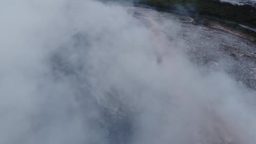 Aerial View of Landfill Spewing Smoke and Fumes