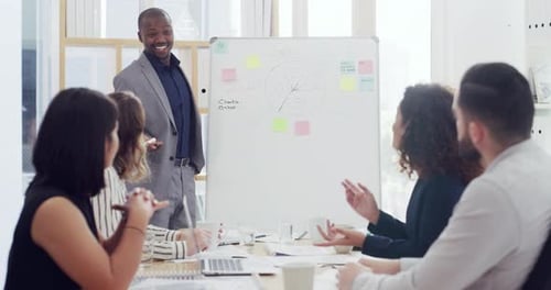 4k video footage of a group of businesspeople applauding during a presentation in an office