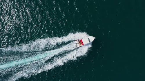 Aerial view to motor yacht floating in the sea