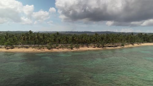 Aerial Slide Tracking View of a Car in Coastline Road, Dominican Republic