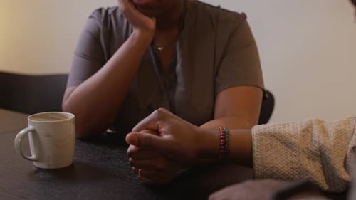 Woman Talking with Man and Sharing Mobile Device