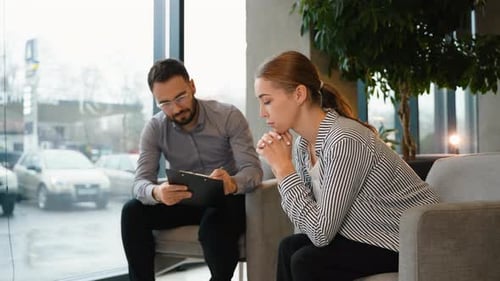 Psychologist Counseling Depressed Woman During Therapy Session
