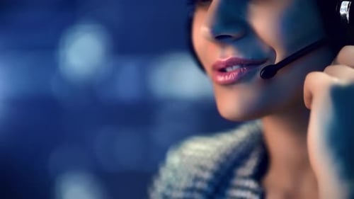 Smiling Woman Wearing Headset Speaking to Customer