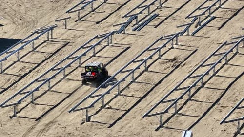 ATV Driving Through Solar Construction Frames