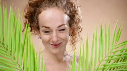 Topless Young Woman in a Studio Looking at Camera, Beauty Concept