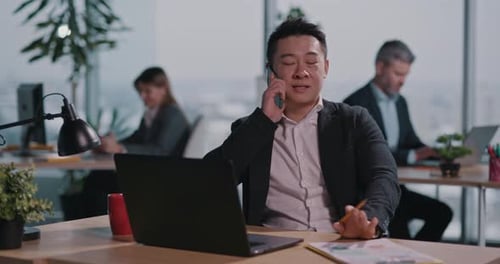 Business People in Office Asian Adult Millennial Businessman Talking Mobile Phone Conversation