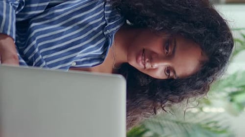 Young Attractive Focused Indian Woman Student Working with Laptop