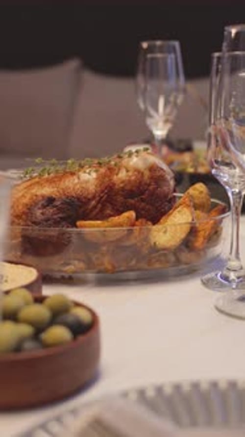 Roasted Meat and Potatoes on Dinner Table