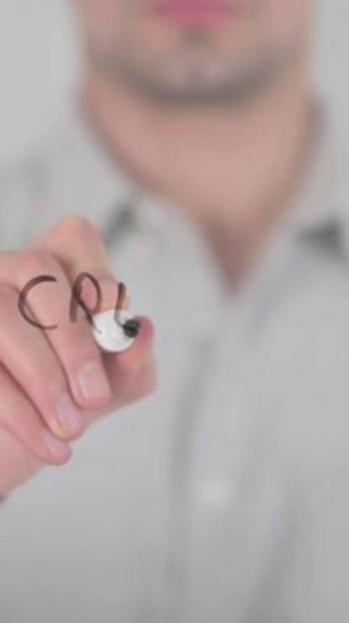 Man Writes Creative Work on Glass Surface