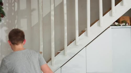 Teen and Boy Walking on the Stairs
