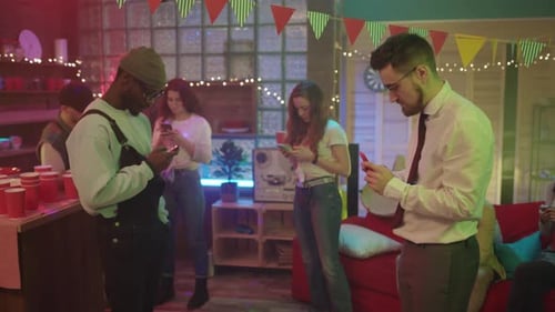 Group of People Using Smartphones at Party