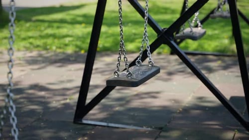 An Empty Children's Swing Closeup