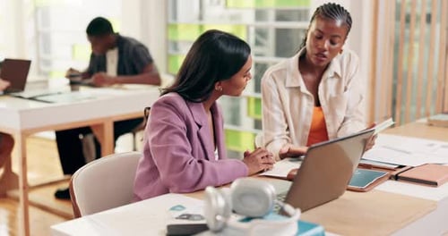 Engaged young adults collaborate in modern office