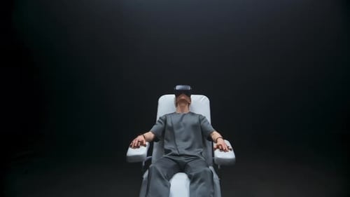 Young Man Wearing Virtual Reality Headset in Chair