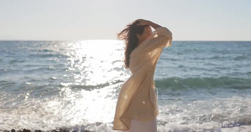 Slow Motion of Walking Young Asian Woman on Beach During Sea Vacation