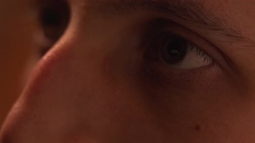 Eye Reflecting Screen in Dark Close Up Shot