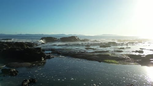 Rocky Shore on the Pacific Ocean Coast Sunny Sunset