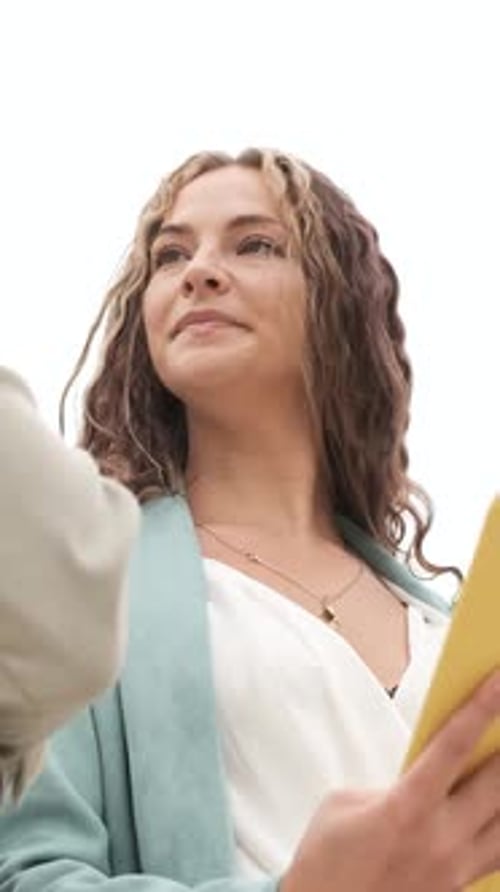 Young Woman Holding Tablet with Another Person