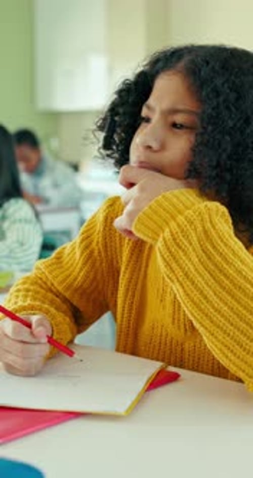Thinking, education and kid in classroom for exam, math and quiz solution at school