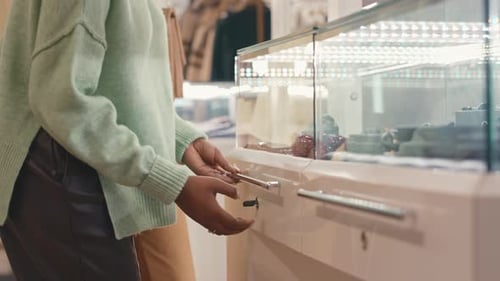 Woman Choosing Accessories in Luxury Boutique