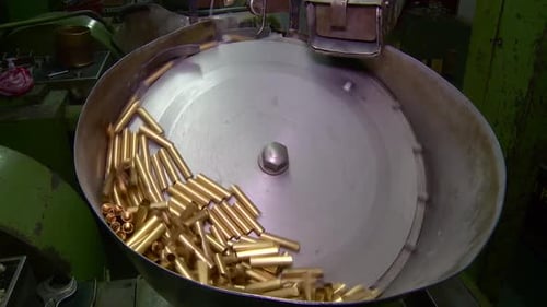 Machine rotates shells for bullets