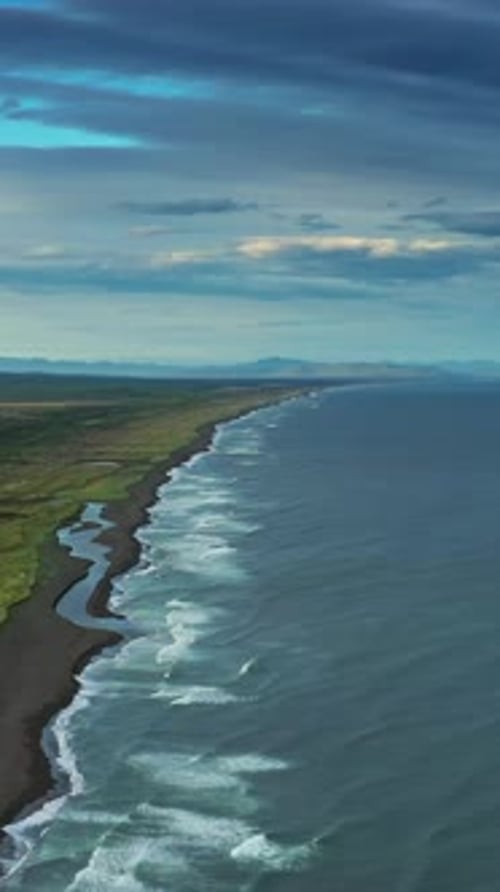 Beach with Black Sand and Volcano