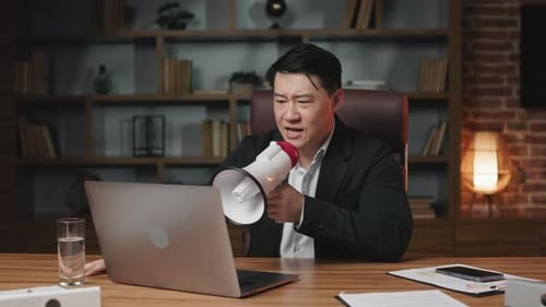 Angry Ceo Scolding Team in Loudspeaker During Video Call