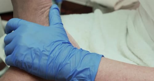Podiatry filing the heel of the left foot