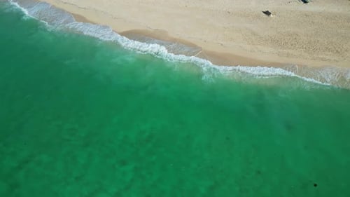 Sea Waves Breaking on Sand Beach