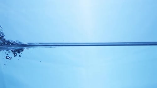 Magnificent water movement in super slow motion in a horizontal line