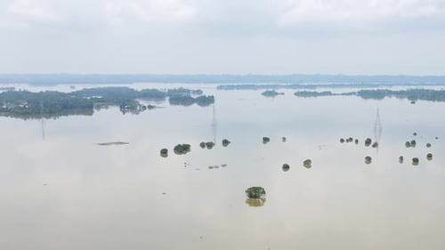Aerial view across Bangladesh village submerged property monsoon affected devastation community