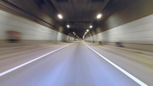 Time Lapse of Night Passage in Long Tunnel with Background Blur