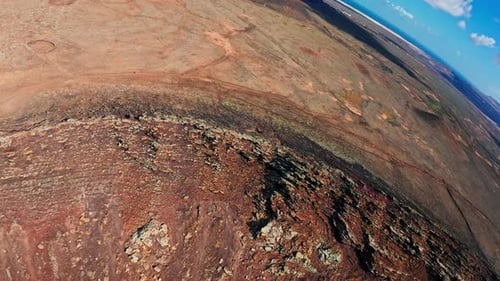Aerial View of Hikers Exploring Volcanic Desert Island
