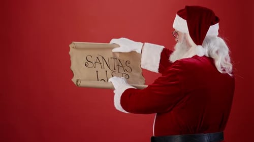 Santa Claus Reading Gift List on Red Background