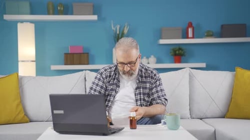 Senior Man in Video Consultation Showing Medication