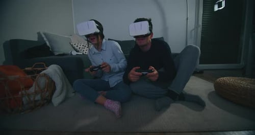 Couple Experiencing Virtual Reality Gaming at Home