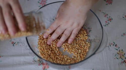 Yellow Split Peas Being Added to Bowl