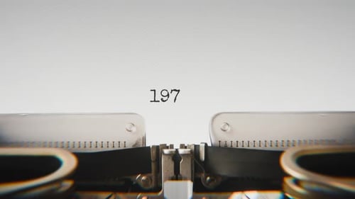 Old mechanical typewriter typing Year 1974 in a close-up view.