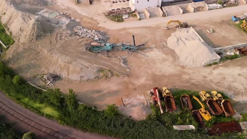 Aerial View of an Aggregate Sand Gravel Plant Stockpiles of Sand and Crushed Stone Heavy Equipment