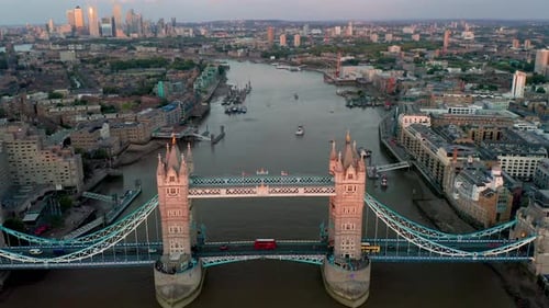 Aerial view of tower bridge at night with city skyline, United Kingdom.