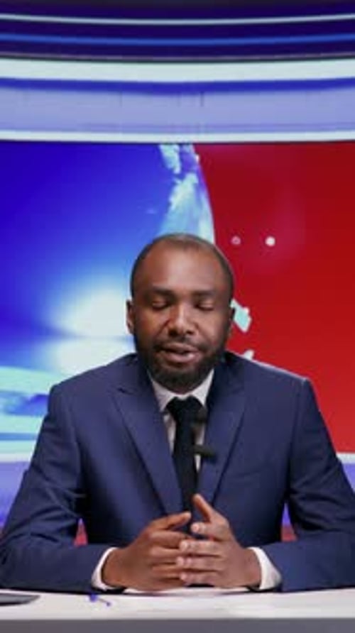 Vertical Video African American News Anchor in Studio