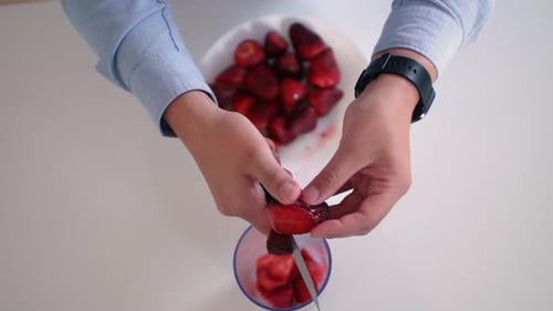 Cutting Fresh Strawberries for Cooking Preparation