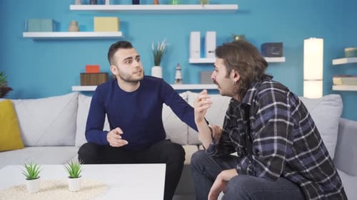 Man Comforting a Sad Friend on Couch