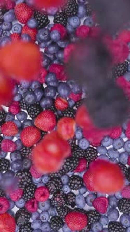 Assorted Berries Falling in Slow Motion