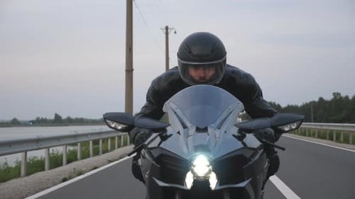 Front View to Biker Riding on Modern Sport Motorbike at Countryside Way Young Motorcyclist Racing